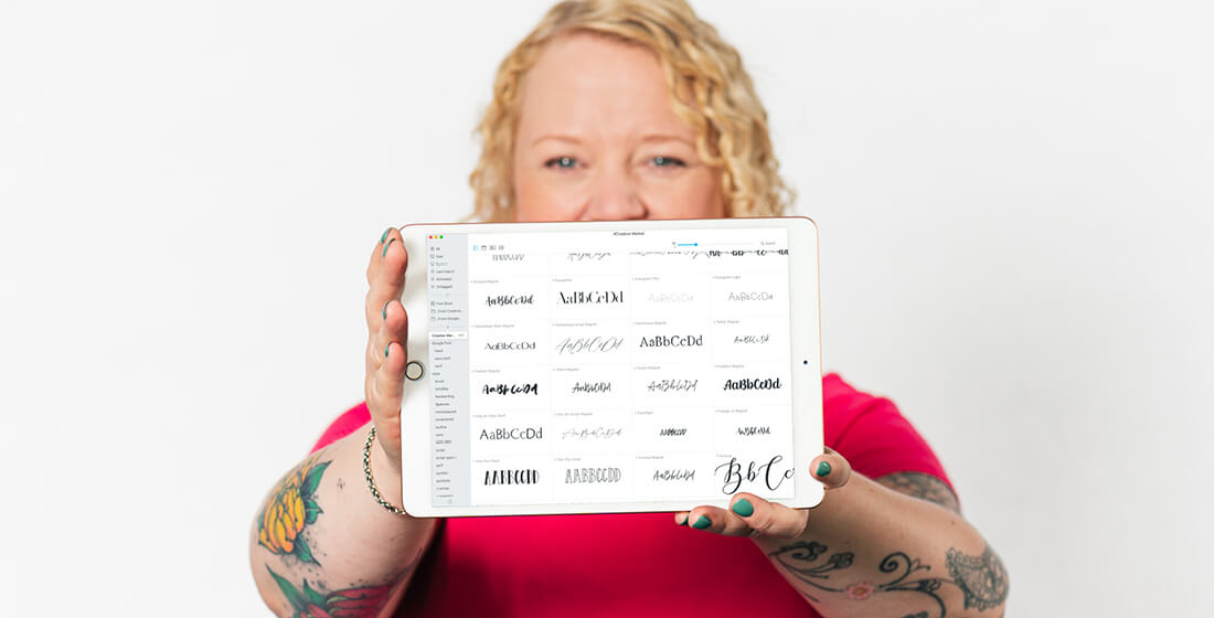 Helen Bee from B Double E holding an ipad showing various fonts for voiceover brand design.