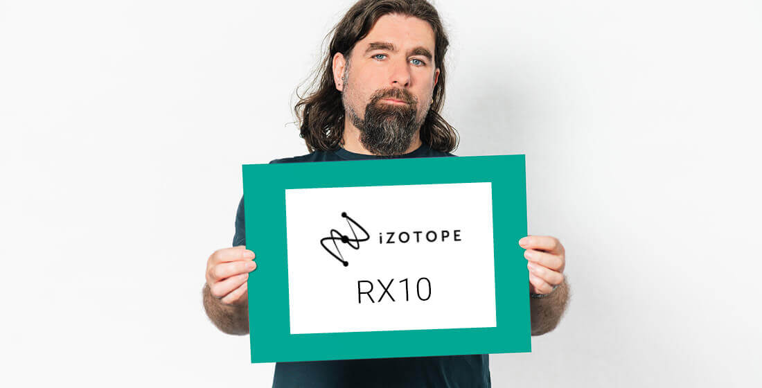 Rob Bee holding an izotope rx10 sign.