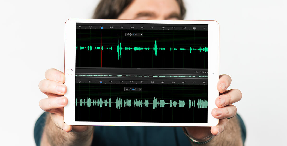 Rob from B Double E holding an ipad with audio samples before and after compression.