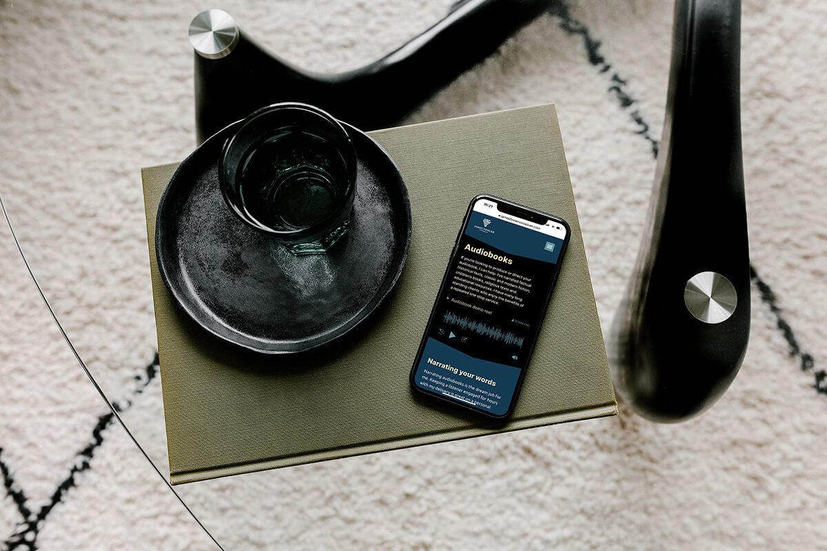 James Fowler Voiceover website audiobooks section shown on a mobile phone.