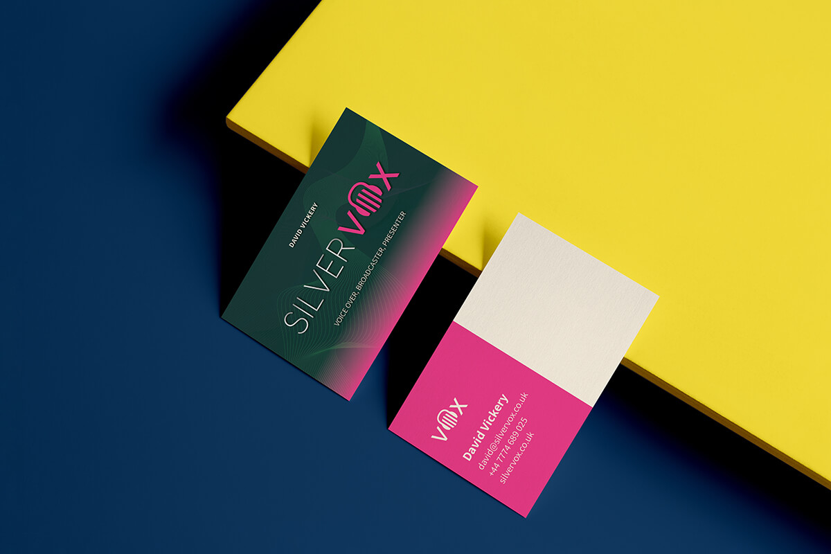 Silver VOX business cards shown on a bright yellow background.