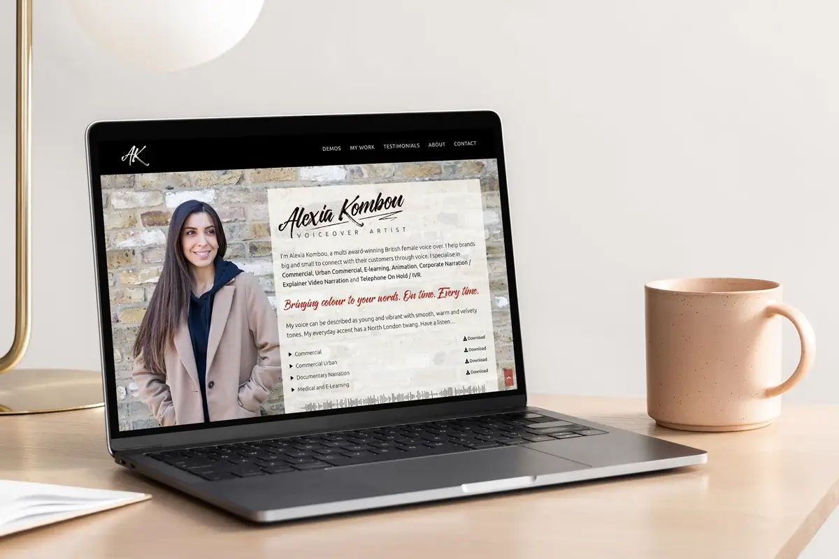Alexia's website on a laptop.