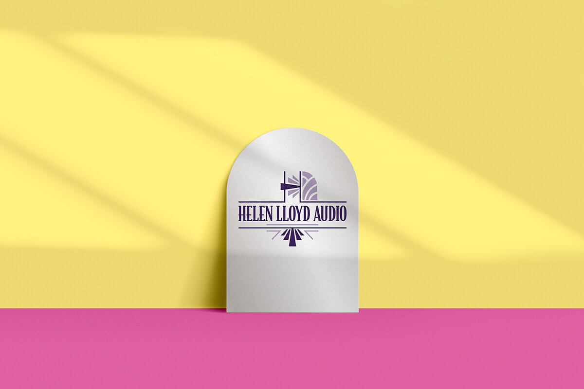 Helen Lloyd's logo shown on a silver background in front of a bright yellow and pink wall.