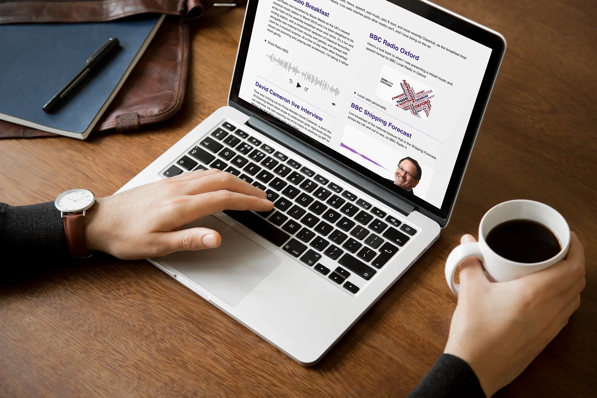 Presenter and Voice Artist Charles Nove's website showing his radio and TV presenter showreels on a laptop.